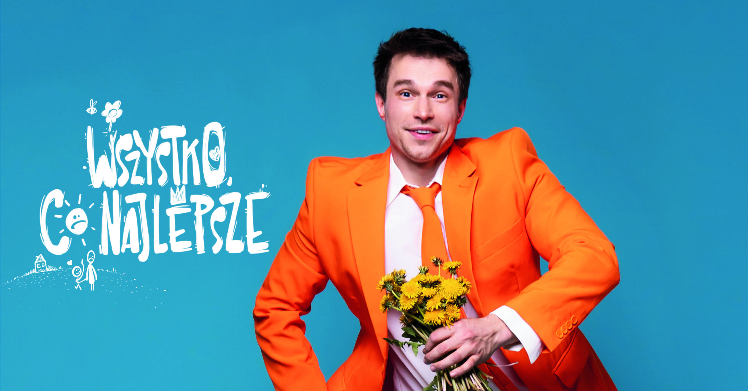 aktor w pomarańczowej marynarce na biebieskim tle